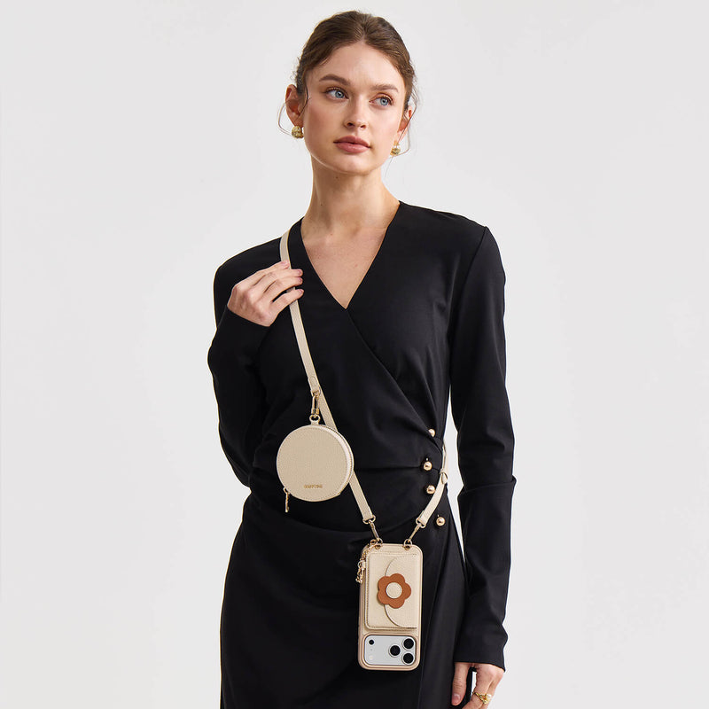 Beige crossbody wallet phone case with round pouch worn with a black dress