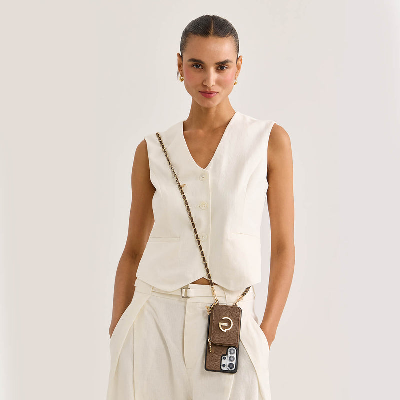 person wearing a crossbody phone case with an adjustable chain and magnetic card wallet
