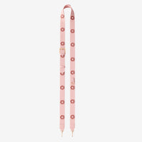 Pink strap with gold hardware on a white background