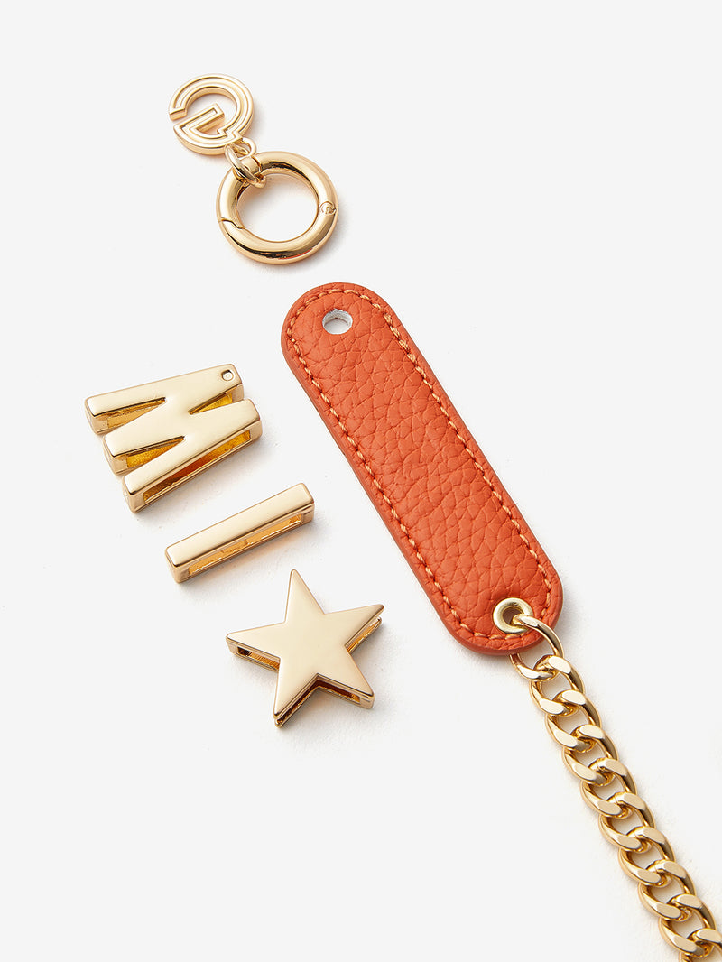 Orange phone case with wristlet
