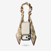 Beige iPhone 17 Pro Max phone case with detachable wallet and silk wrist strap for shopping