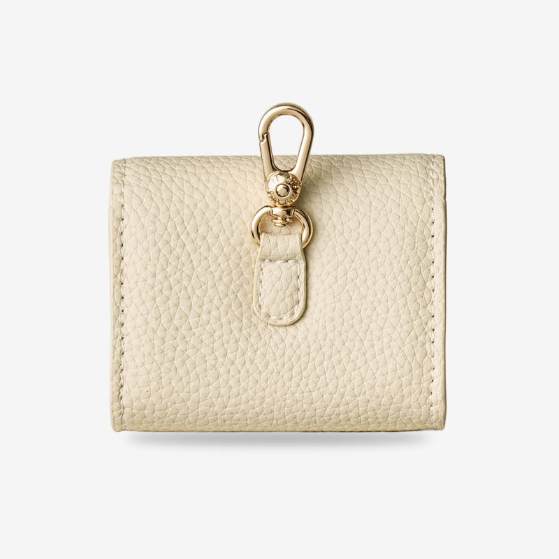 Elegant beige AirPods case pouch featuring premium leather finish and minimalist design