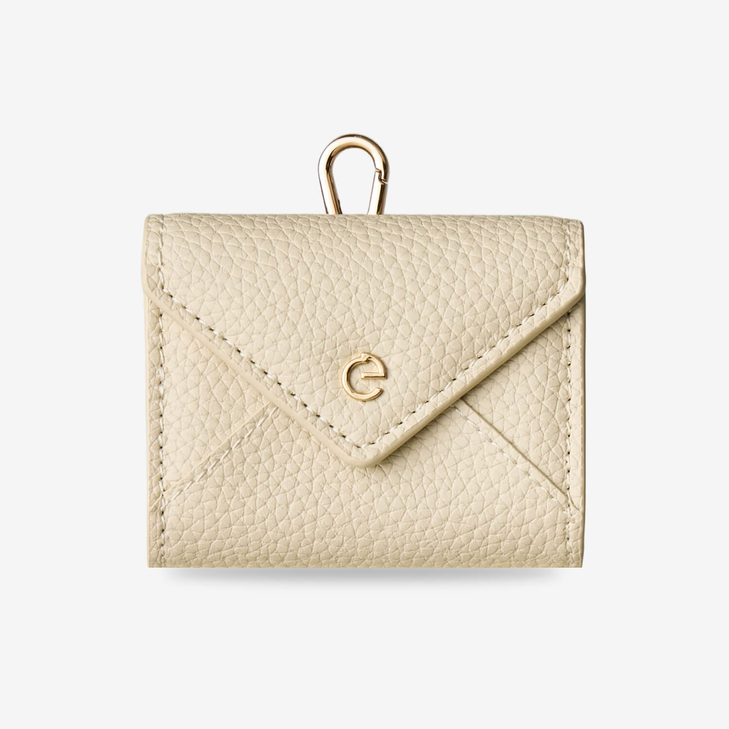 Beige envelope-inspired AirPods pouch with leather finish and detachable gold-tone clip for everyday carry
