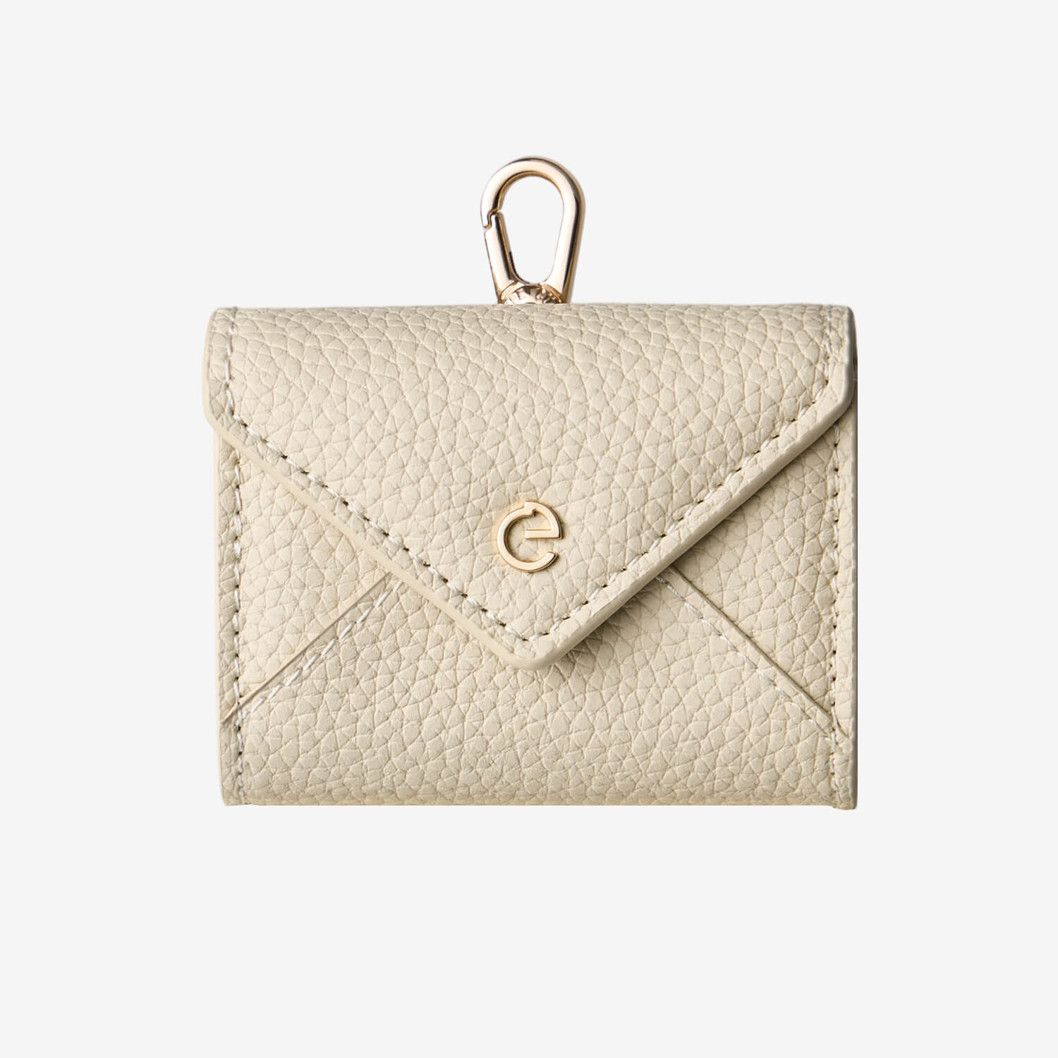 Beige envelope-inspired AirPods pouch with leather finish and detachable gold-tone clip for everyday carry