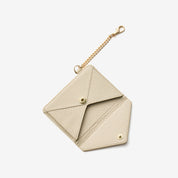 Beige envelope-style wallet with detachable chain for stylish everyday carrying