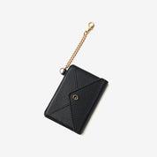 Black leather wallet accessory featuring an elegant envelope design and detachable chain attachment