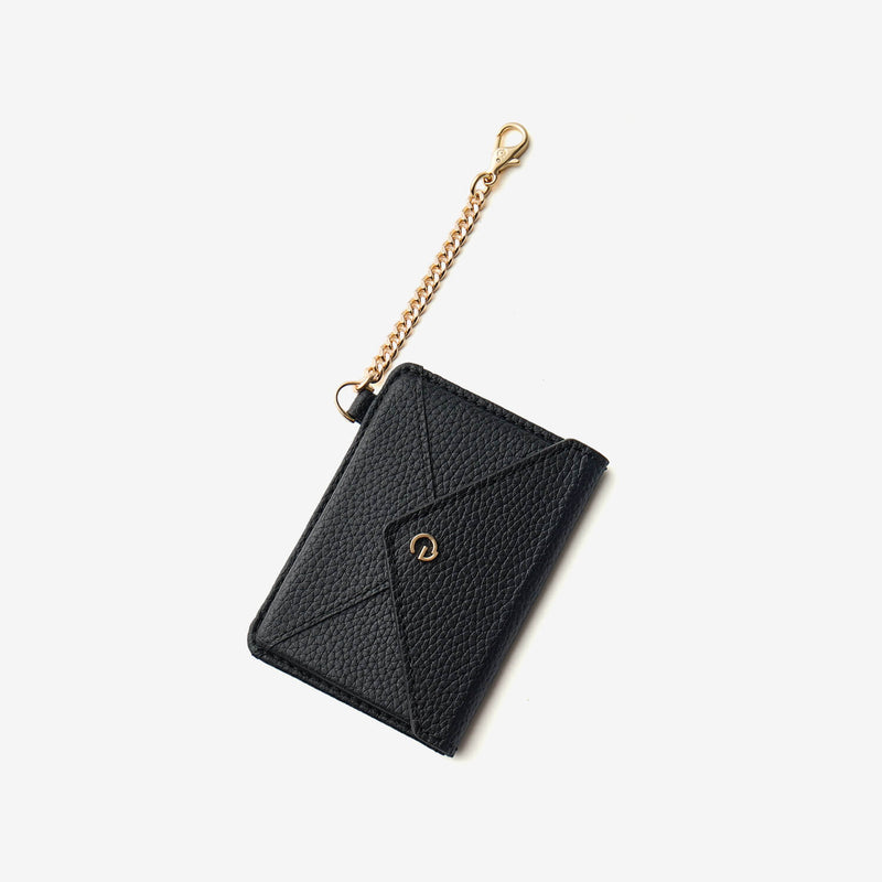 Black leather wallet accessory featuring an elegant envelope design and detachable chain attachment