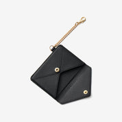Elegant envelope-inspired wallet accessory with black leather finish for daily essentials