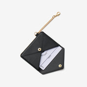 Elegant detachable wallet accessory with black leather finish and refined chain clip
