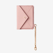 Stylish leather card holder with pink finish and elegant chain detail for everyday use