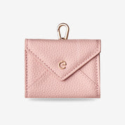 Pink leather AirPods pouch featuring an elegant envelope design for wireless earbuds and small essentials