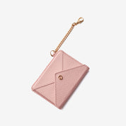 Fashionable card holder wallet with pink leather finish and detachable gold-tone chain attachment