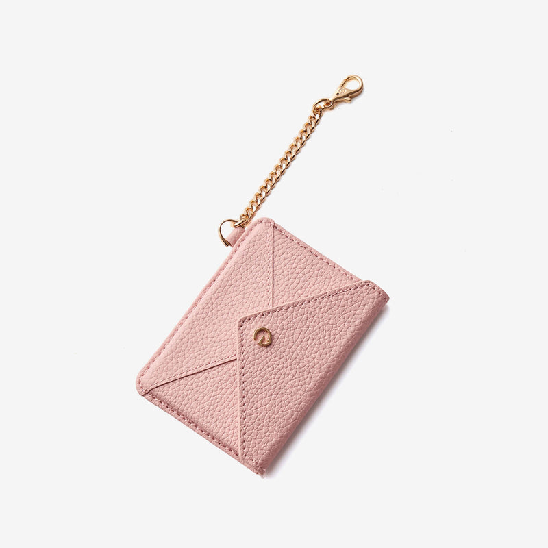 Fashionable card holder wallet with pink leather finish and detachable gold-tone chain attachment