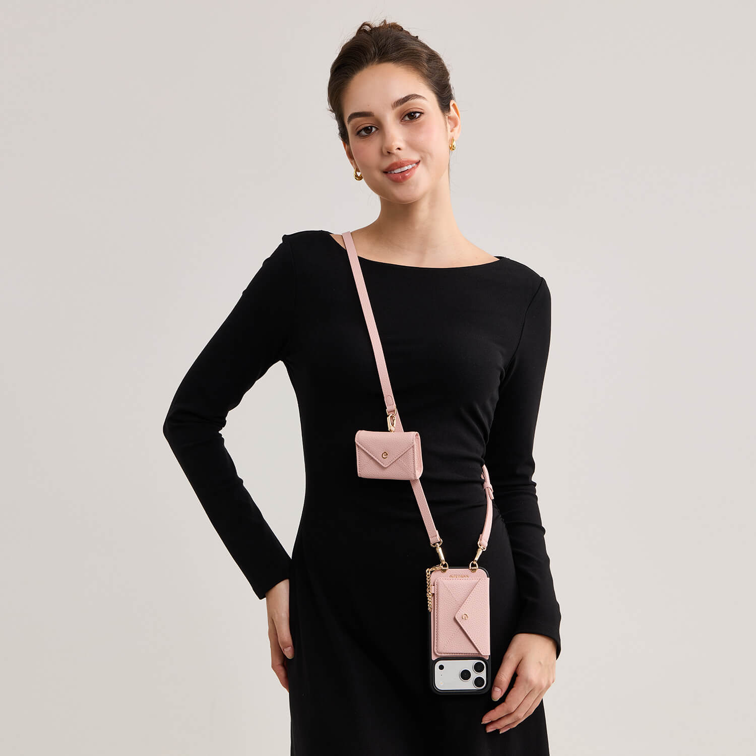 iPhone 17 pro max MagSafe wallet phone case with envelope-inspired design, pink leather finish and crossbody strap for commuting