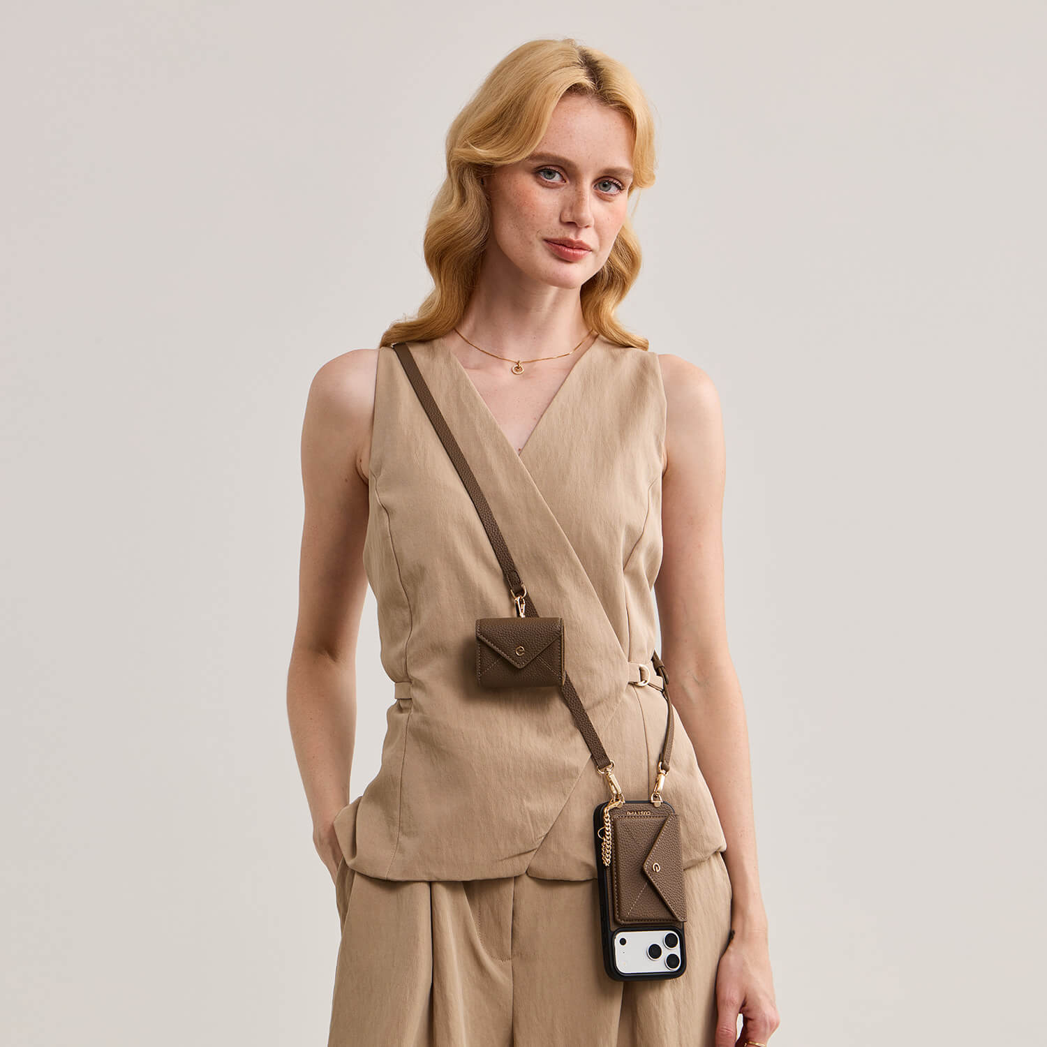 Elegant mocha iPhone 18 Pro MagSafe case with detachable envelope wallet and crossbody strap for travel and daily use