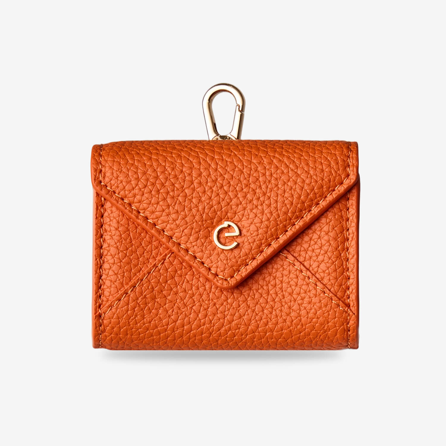 Orange envelope-inspired AirPods pouch with leather finish and gold-tone clip for everyday carry