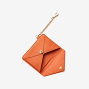 Slim orange leather card wallet accessory designed for commuting, travel and everyday essentials