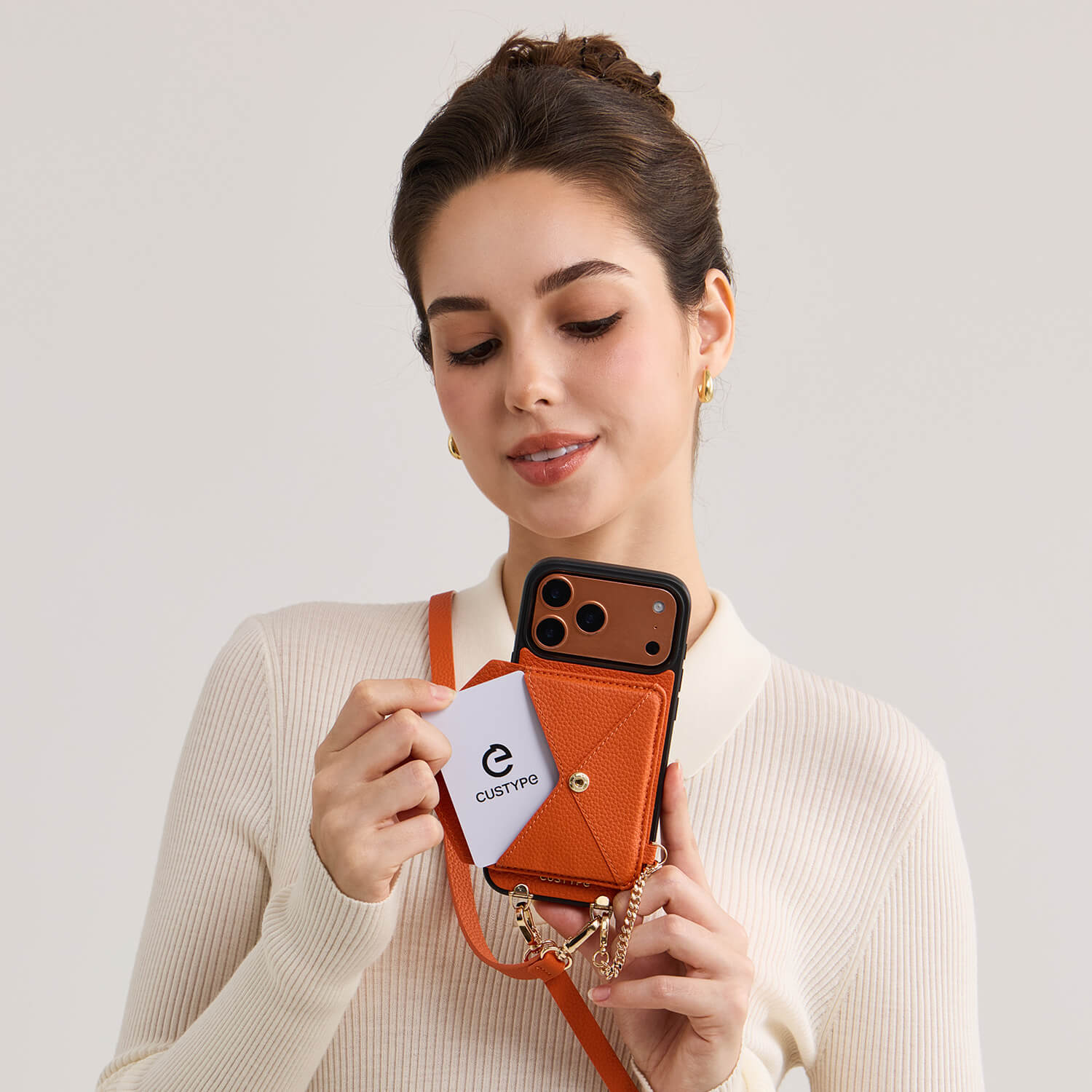 Orange leather iPhone 17 pro magsafe case with detachable wallet for keeping cards organized and accessible
