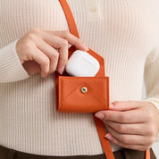 detachable orange Airpods pouch