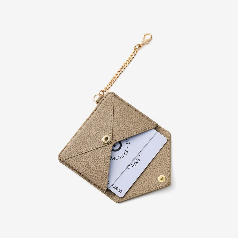 Envelope-inspired card holder wallet in taupe leather designed for convenient card organization and everyday carry