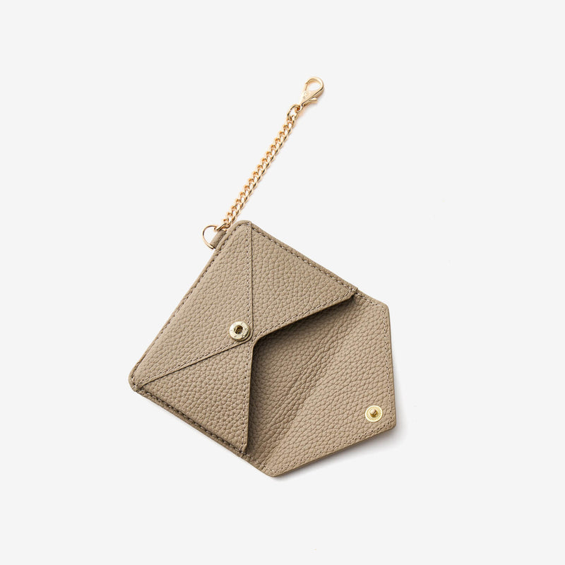 magnetic wallet with envelope-inspired design and gold-tone chain details