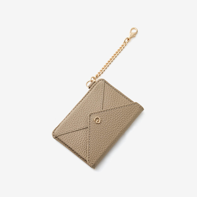 Stylish taupe card wallet featuring a refined envelope design and gold hardware details