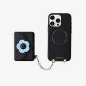 Black phone case with floral design and chain, and a matching cardholder for travel