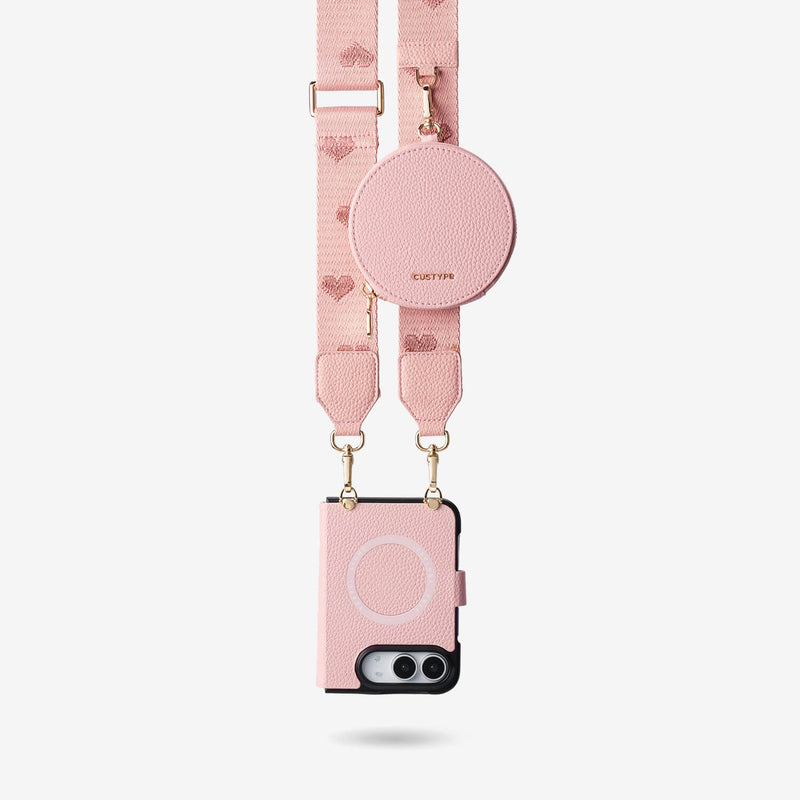 Pink iPhone DUO MagSafe case with heart pattern strap and detachable round pouch