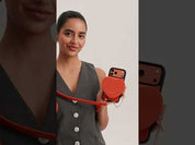 Orange iPhone 17 Pro Max leather crossbody phone case with cute heart pouch for hands-free