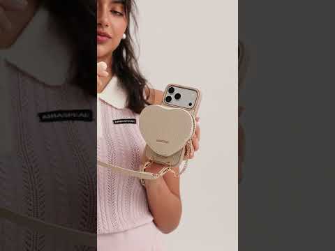 Beige iPhone 17 Pro Max leather crossbody phone case with Heart pouch for hands-free