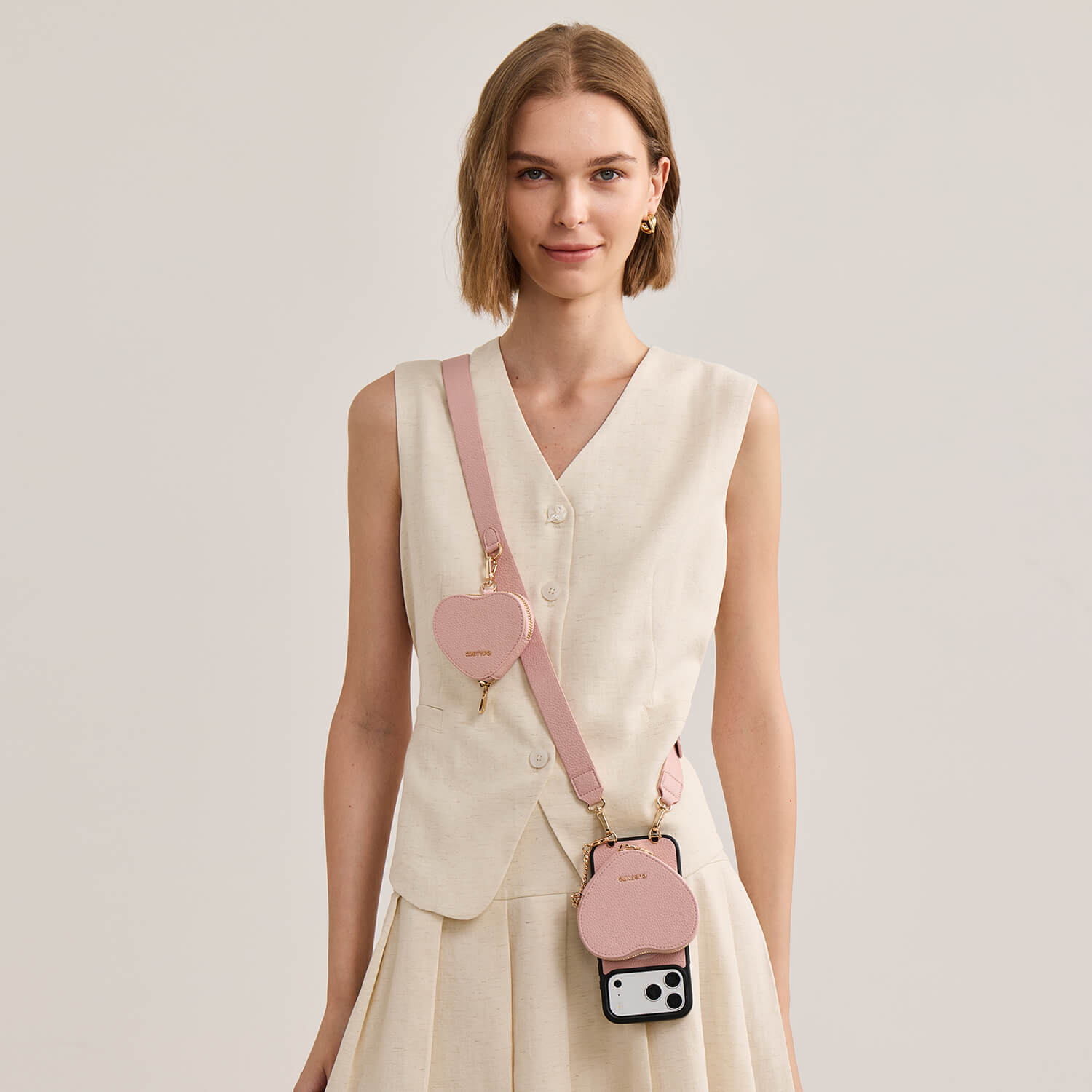 roam_kit_iphone_case_with_magnetic_heart_pouch_and_wide_strap_light_pink_1.jpg