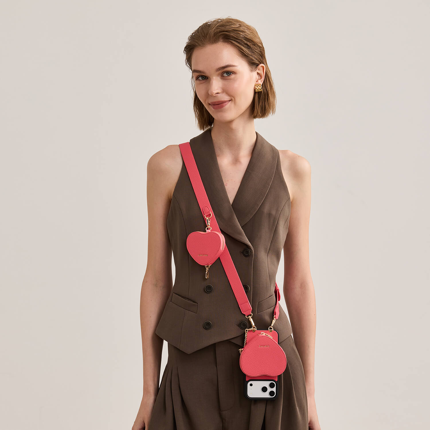 roam_kit_iphone_case_with_magnetic_heart_pouch_and_wide_strap_peach_pink_1.jpg