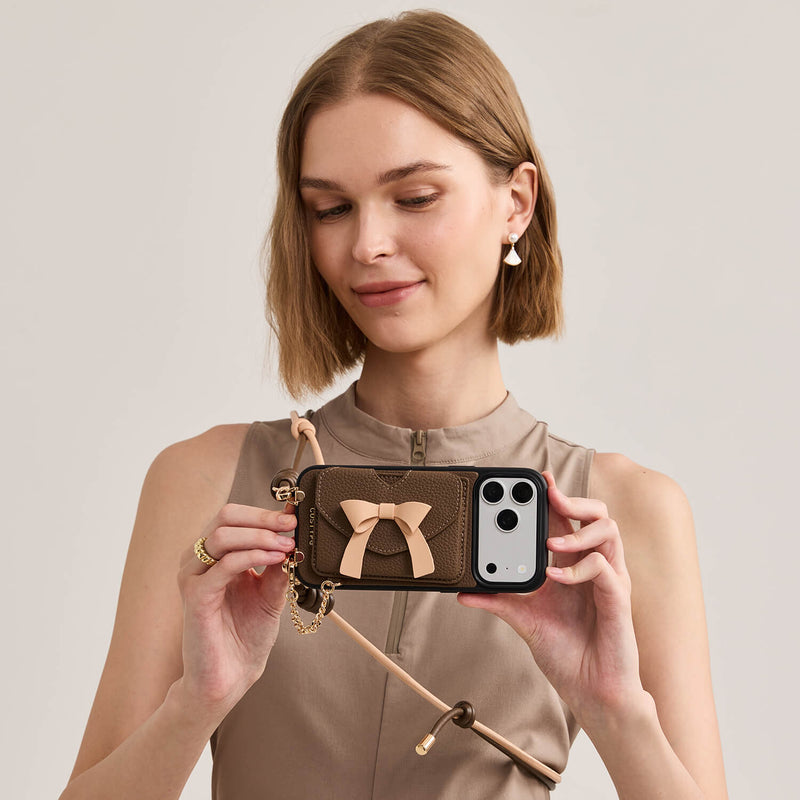 Mocha leather iPhone 17 Pro wallet phone case with magnetic card holder, bow accent and gold-tone metal details for travel and outings