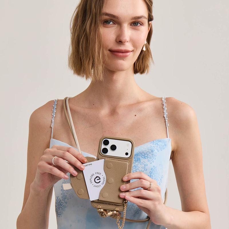 Taupe iPhone 17 Pro Max crossbody phone case with removable bow wallet, card holder function and luxury gold-tone metal accessories