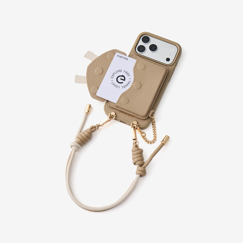 Taupe iPhone 18 Pro magnetic wallet phone case featuring bow wallet styling, up to 4 cards and cash storage, and refined gold-tone metal details for travel