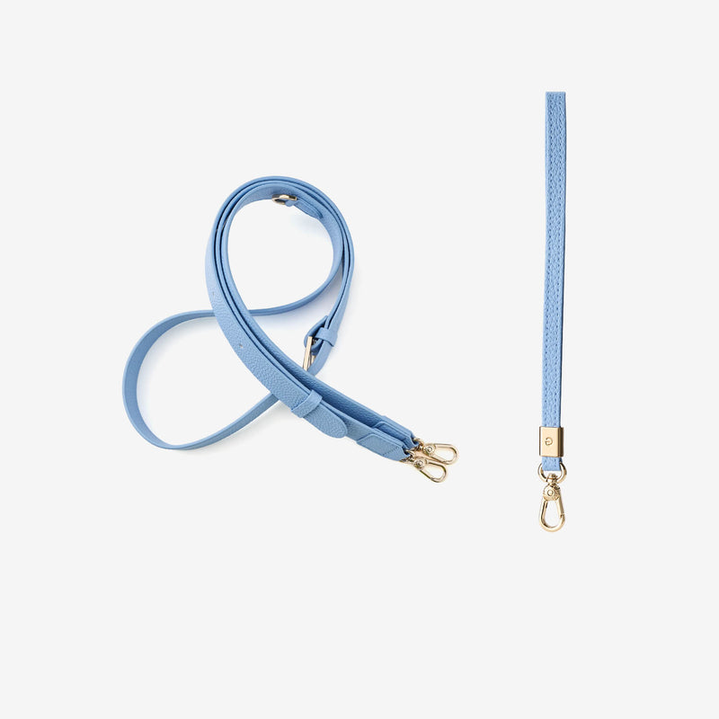 blue crossbody strap and wrist strap with gold hardware