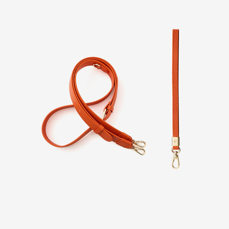 Orange premium leather crossbody strap and wrist strap with gold hardware